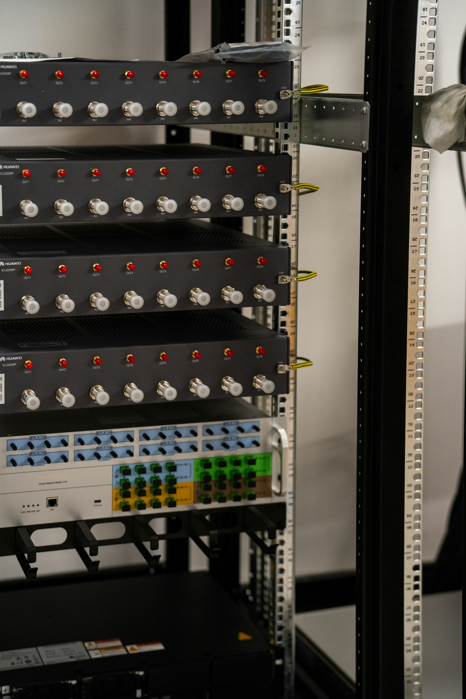 A server rack filled with network and electronic equipment