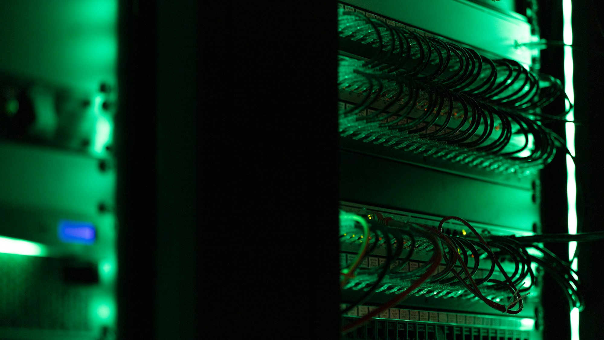 Rows of server racks in a data center — the kind of facility New Jersey discovered was running 62 unpermitted generators to keep powered
